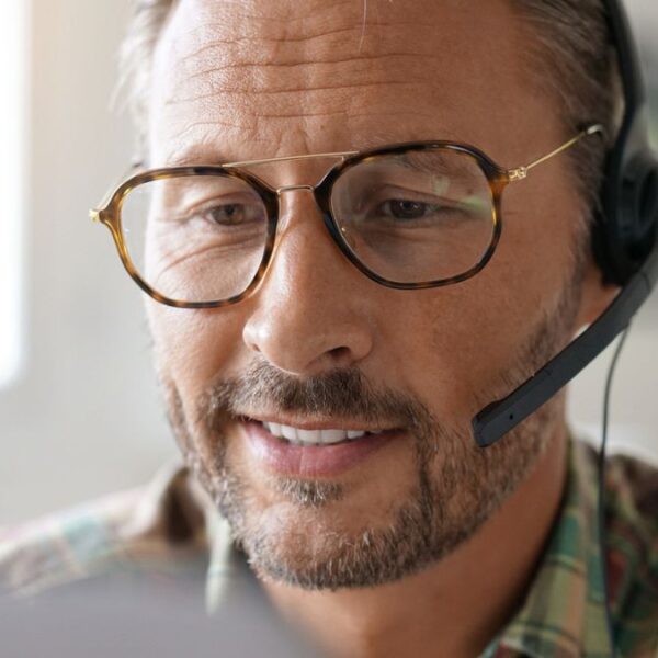 matrure man with glasses working