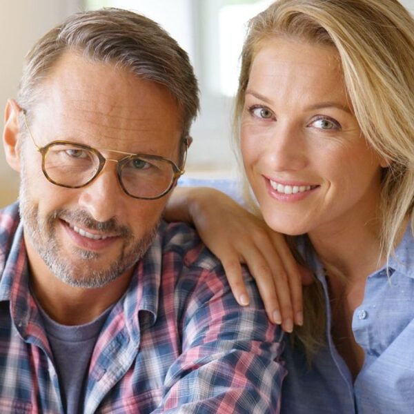 mature couple smiling together at home