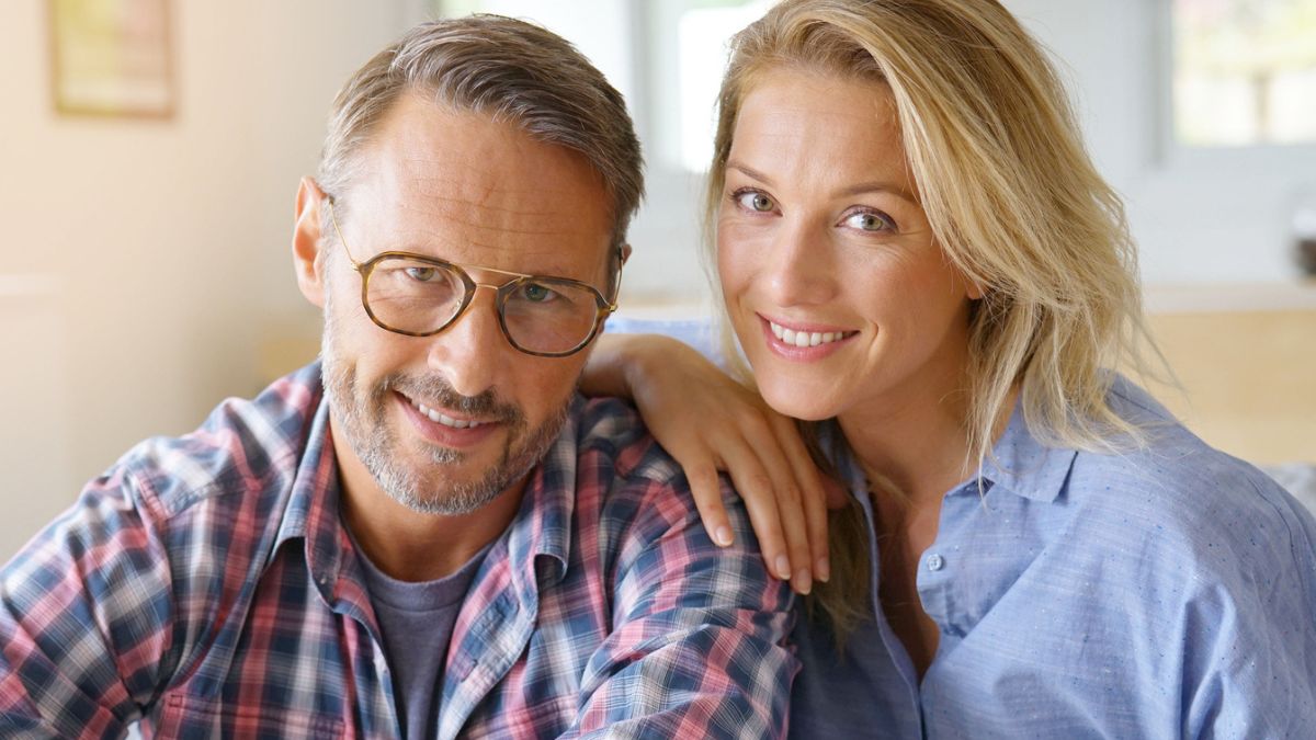 mature couple smiling together at home