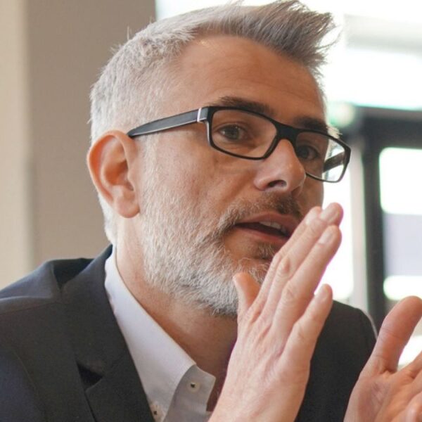mature man with glasses in an office