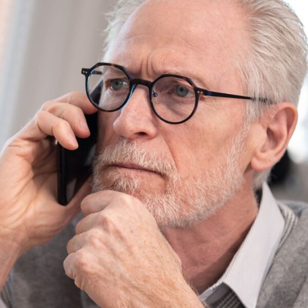 senior man making a phone call
