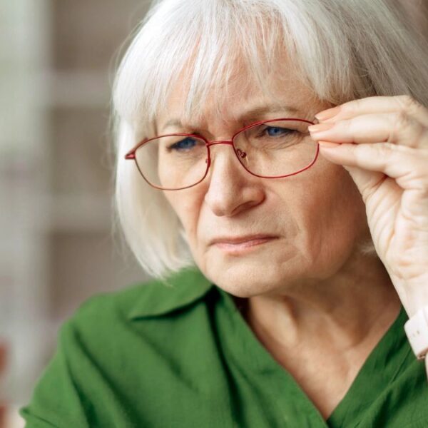 senior woamn staring at her phone