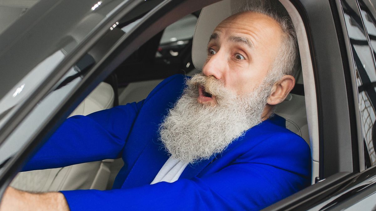 sports car blue suit beard