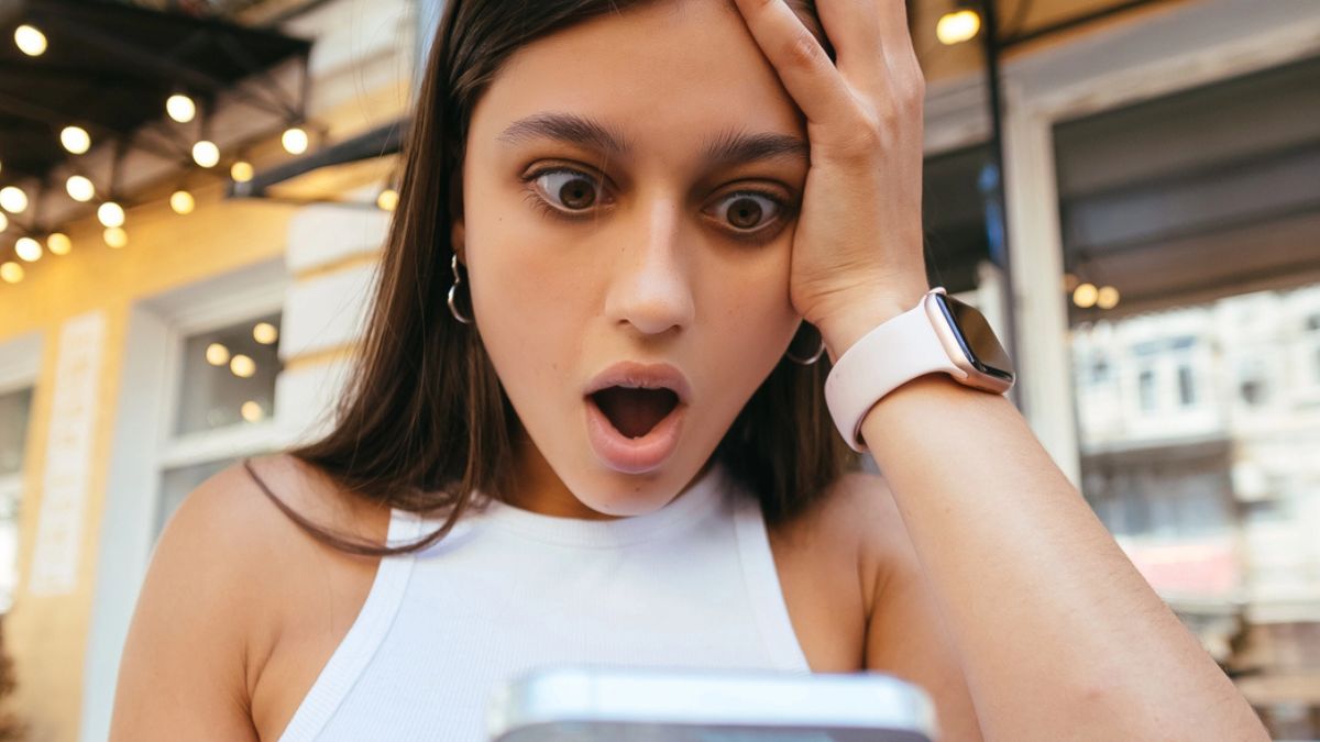 woman amazed looking her phone