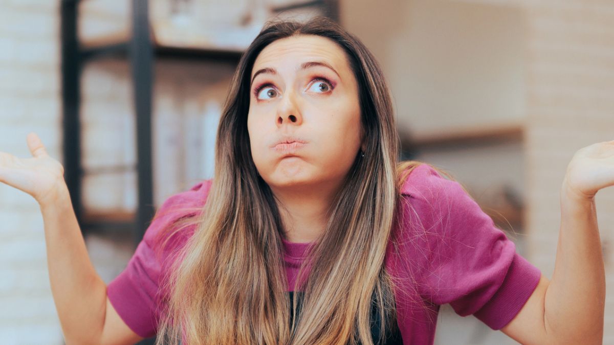 woman confused hands up