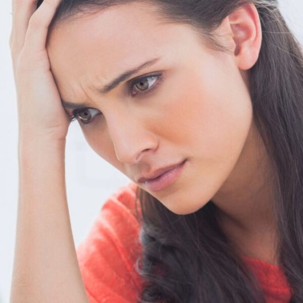 woman confused looking at laptop