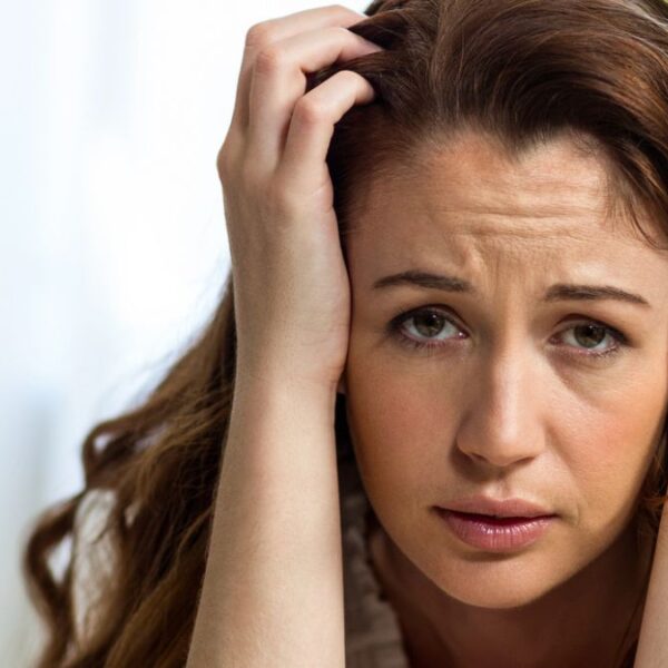 woman confused resting on arm