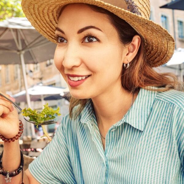woman eating food outside
