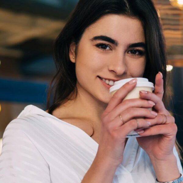 woman happy at a cafe