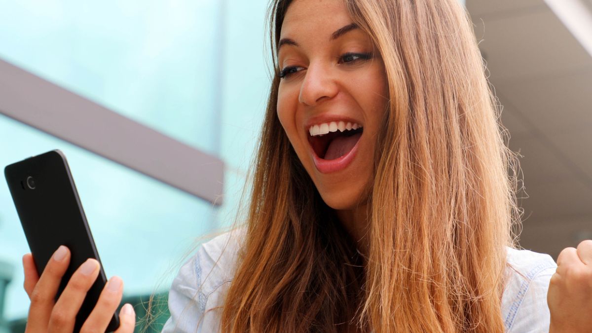 woman happy over her phone