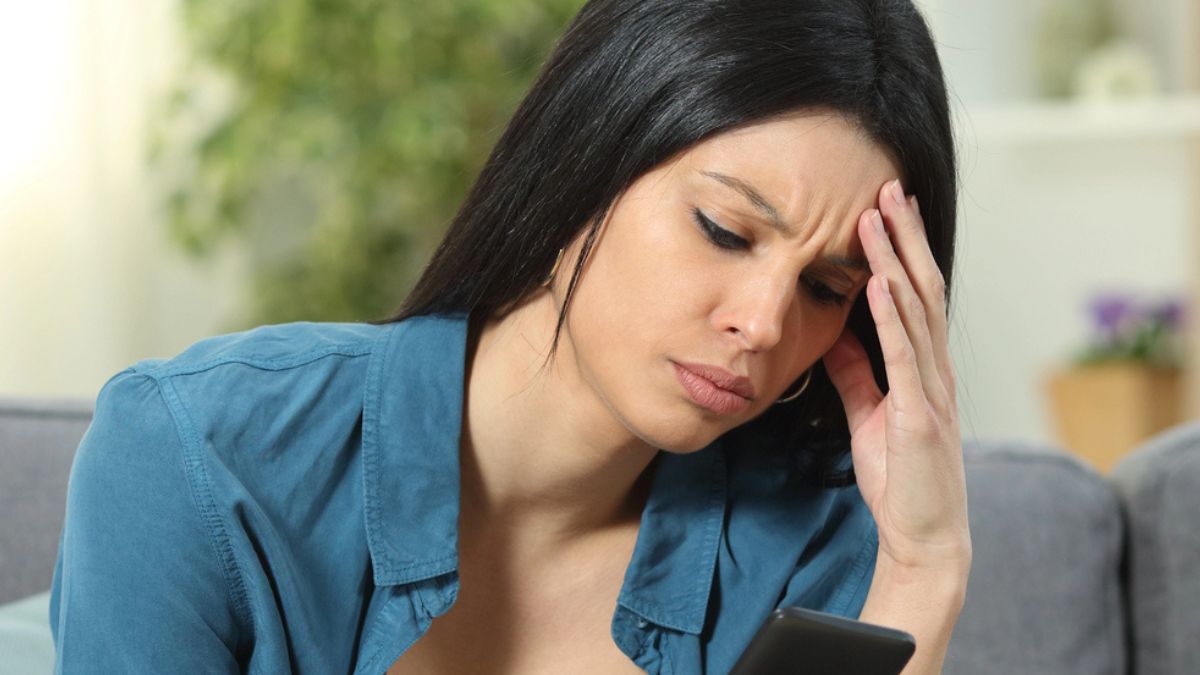woman headache phone