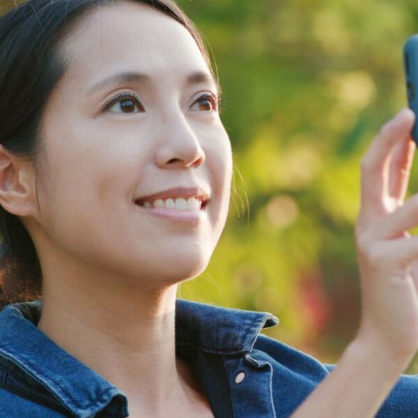 woman holding her camera phone