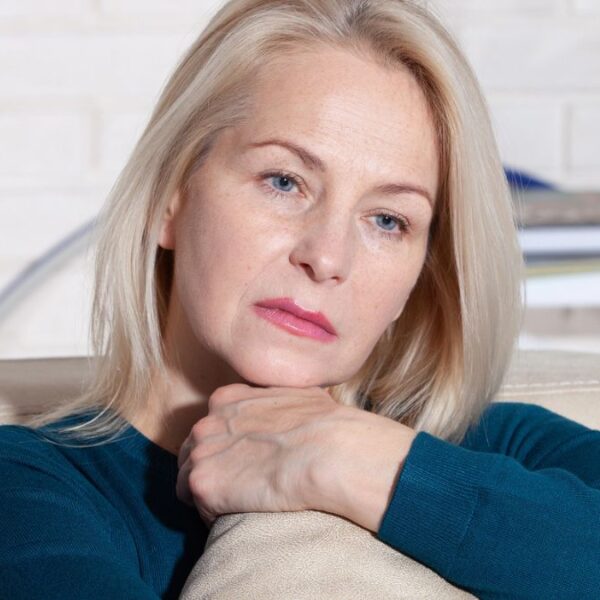 woman hugging a pillow