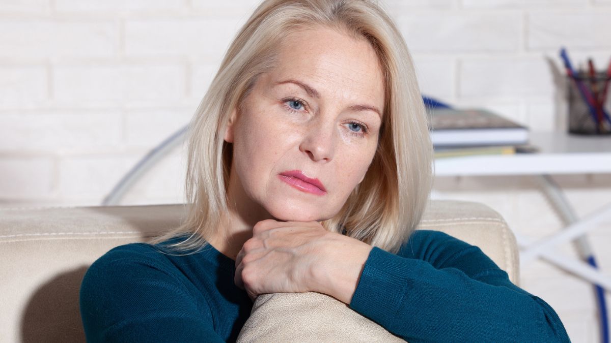 woman hugging a pillow