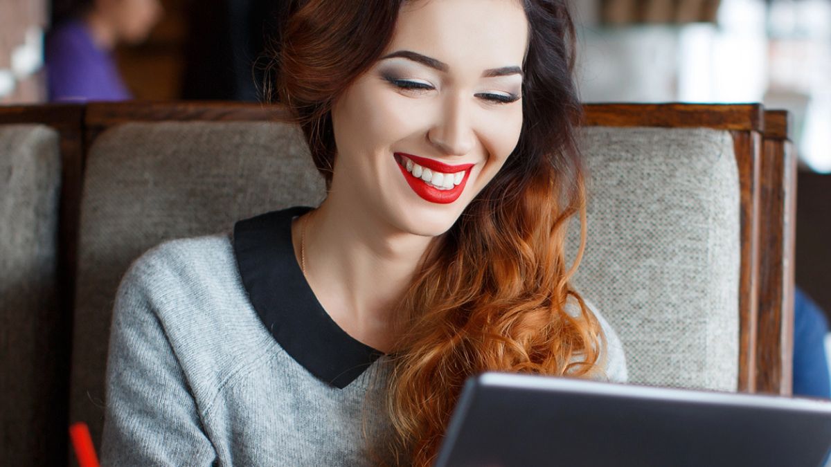 woman looking at a tablet