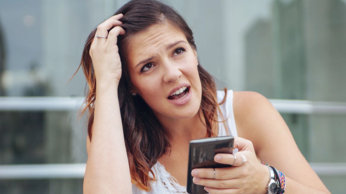 woman sad angry on her phone