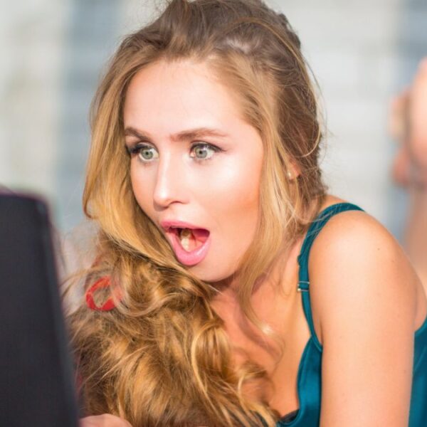 woman shocked her lapto