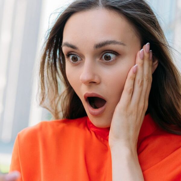woman shocked on her phone