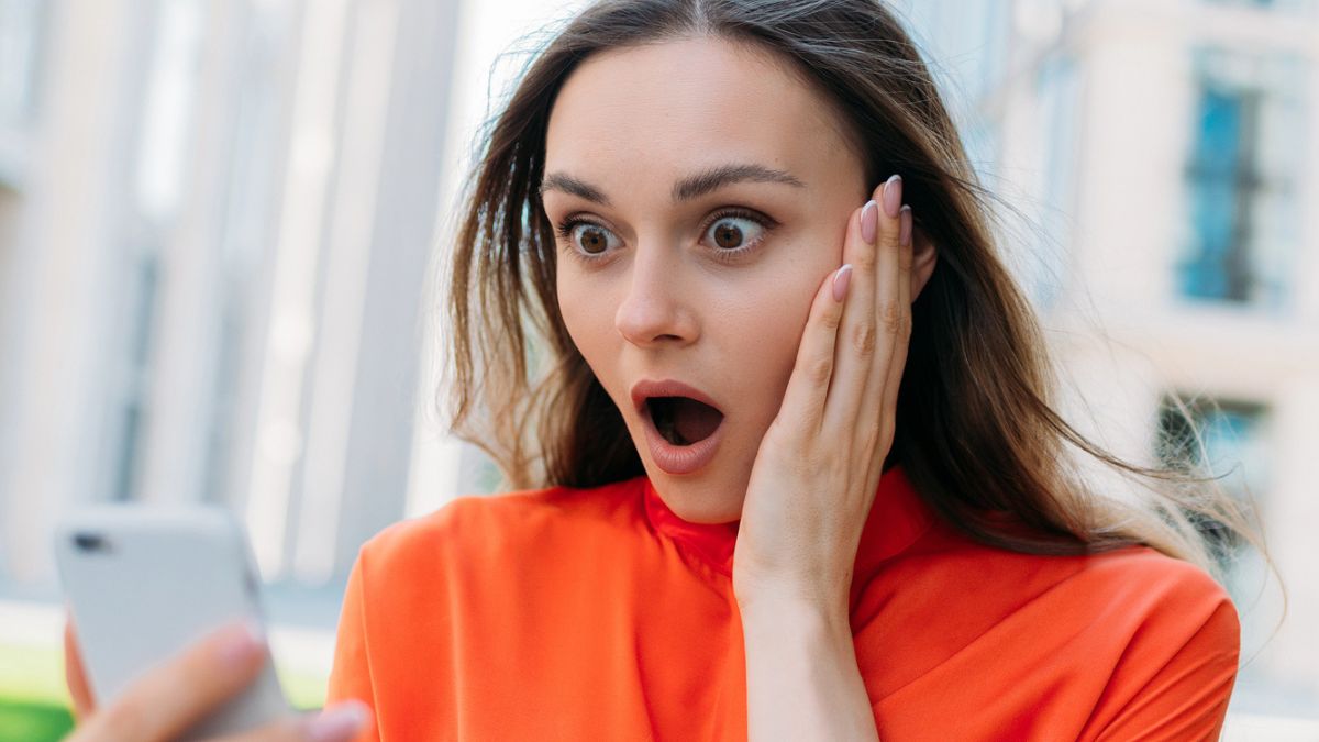 woman shocked on her phone