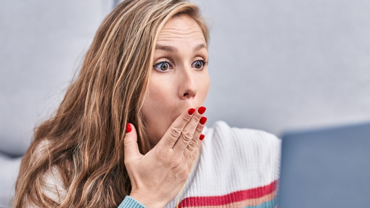 woman shocked on laptop