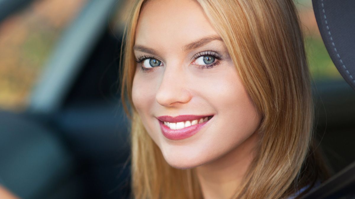 woman smiling in a car
