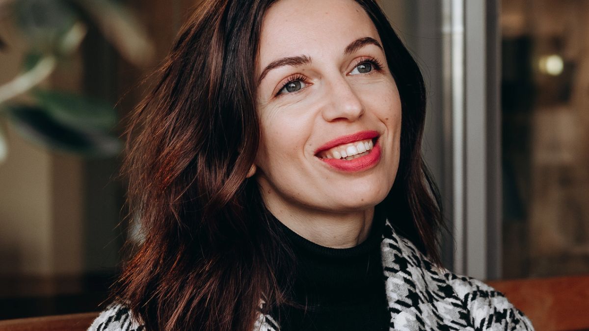 woman smiling with a coat