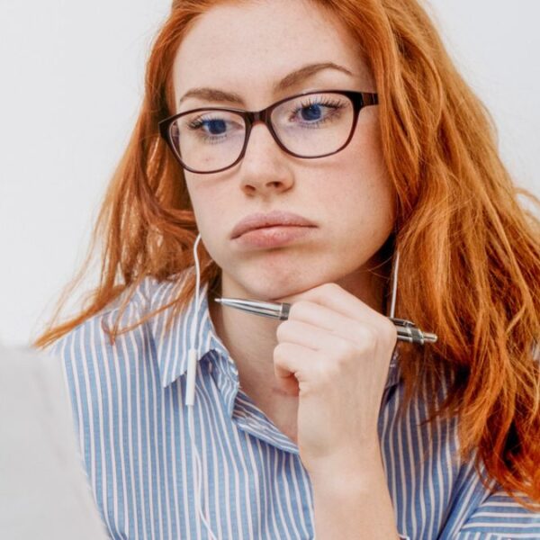 woman staring at documents