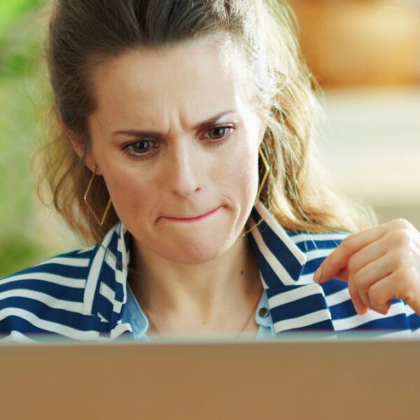 woman tight lipped laptop