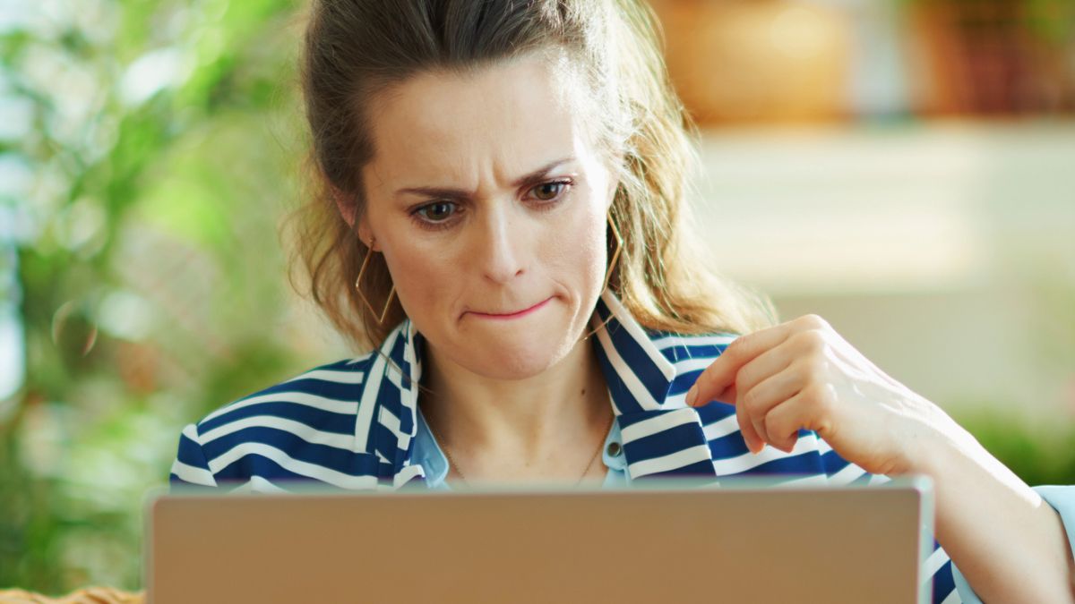 woman tight lipped laptop