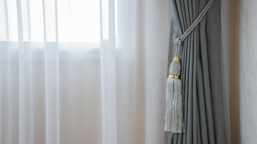 Low-Cost Ways to Make Your Home More Secure When You Live Alone Curtains Closed